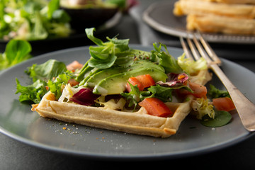 Belgian Waffles with avocado and tomatoes. Perfect breakfast for healthy food or lose weight.