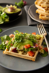 Belgian Waffles with avocado and tomatoes. Perfect breakfast for healthy food or lose weight.