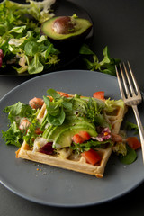 Belgian Waffles with avocado and tomatoes. Perfect breakfast for healthy food or lose weight.