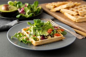 Belgian Waffles with avocado and tomatoes. Perfect breakfast for healthy food or lose weight.