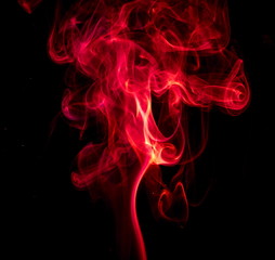 Obraz premium Red smoke on black background