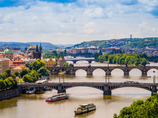 Fototapeta na wymiar Panoramic view of Prague and its bridges through Vltava river, Czech Republic
