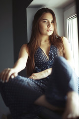 young sexy girl in the evening at home