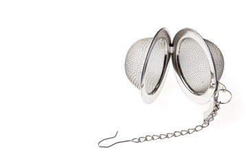 Tea strainer on a chain isolated for white background. A tea strainer is a kitchen accessory close-up.