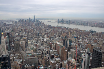 Fototapeta premium Aerial view of Manhattan in New York City showing the classic high rise buildings and city scape in the USA