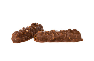 Chocolate bar on a white background. Candy with peanuts and raisins, caramel, puffed rice waffles, in chocolate isolated on white background.