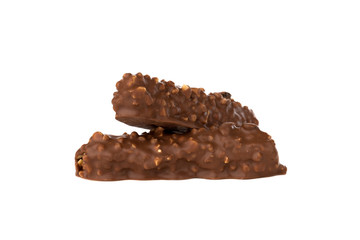 Chocolate bar on a white background. Candy with peanuts and raisins, caramel, puffed rice waffles, in chocolate isolated on white background.