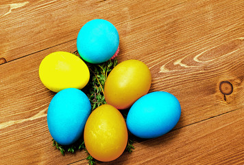 colorful easter eggs on wooden background