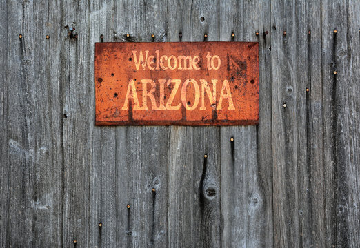 Rusty metal sign with the phrase: Welcome to Arizona.