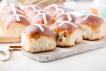Obraz na płótnie Canvas Freshly baked homemade hot cross buns