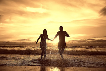 silhouette in love sunset sea / newlyweds in honeymoon at sea, vacation luck summer sea beach,...