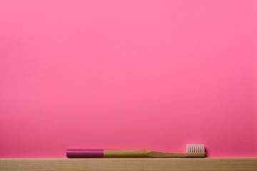 bamboo toothbrushes on pink background. Place for text. Ecoproduct.   eco-friendly