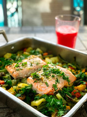 Baked salmon on vegetables