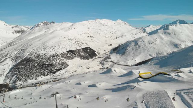 Skiers skiing in Livigno ski Alpine resort, Livigno, Italy, Europe.