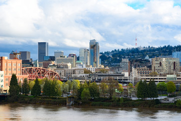 Fototapeta na wymiar Day view of Portland, Oregon downtown from Willamette river bank