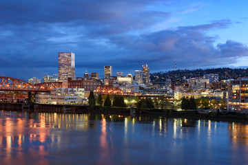 Fototapeta na wymiar Evening twilight view of Portland, Oregon downtown from Willamette river bank