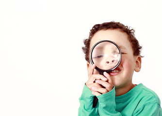 young boy with magnifying glass ready to explore stock image on white background stock photo