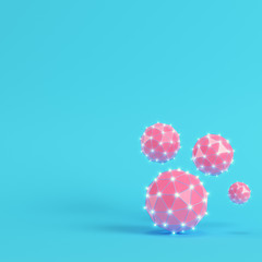 Pink low poly abstract glowing spheres on bright blue background in pastel colors