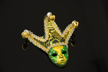 miniature Carnival mask on black