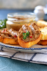 Sandwichs with homemade beef liver pate on a white plate.