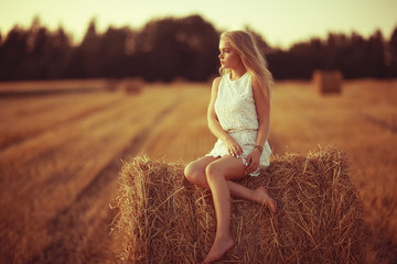 beautiful model posing outdoor nature / adult girl model outdoor nature, happy woman in a summer landscape field