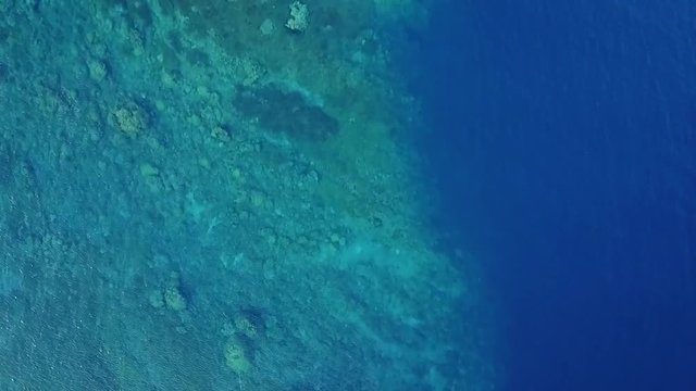Drone descending into Tropical Waters in Papua New Guinea
