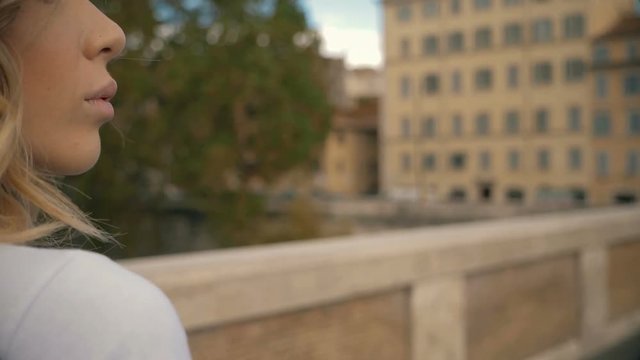 lonely sensual young woman walking,contemplating the city of Rome-slow motion