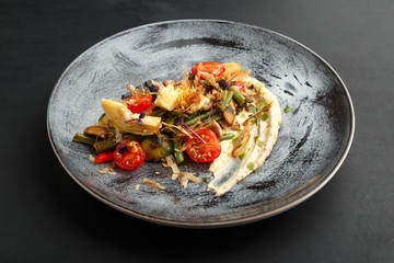 Green bean, tomato and artichoke salad with Microgreens and white sauce.