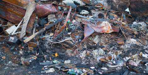 A pile of rusty, burnt metal scrap
