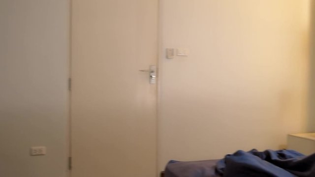 sexy woman dressed in seductive underwear finds her man asleep on the bed. she is disappointed.