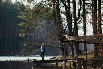 Beautiful portrait of a pregnant woman in the forest.