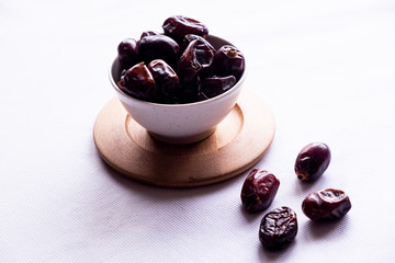 Black Date In The Cup.Isolated With White Background.