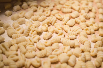 Pasta raw closeup background. Delicious dry uncooked ingredient for traditional Italian cuisine dish. Textured variety shapes. Top view. Copy space