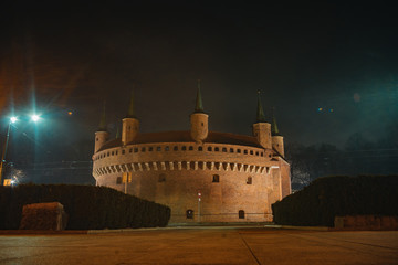 Kraków Barbican. Ancient historical fortress in Poland. Gate to the city, night dusk shot