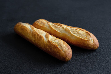 French baguette on dark background