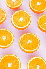 Background of oranges fruits. Many halves of fresh oranges, top view. Citrus for making juice. A lot of sliced oranges on white background. Concept