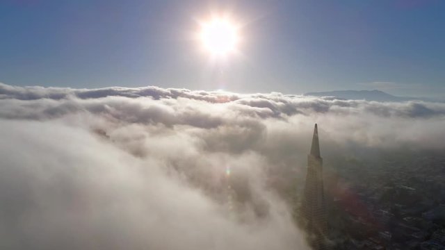 SAN FRANCISCO, CA, USA. Aerial drone 4K view of a slender, tapering silhouette of the obelisk. Famous American building in a cloudy skyline.