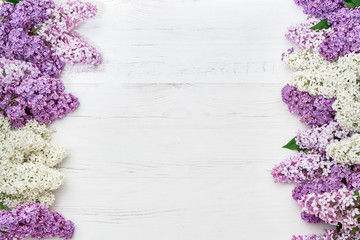 Floral pattern of lilac branches, flowers background. Flat lay, top view.