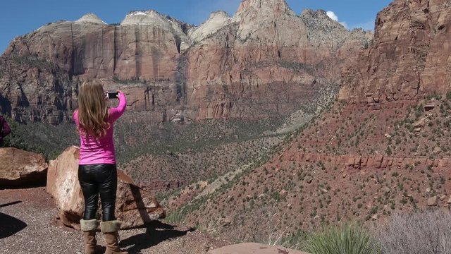 Female Tourist taking a Picture in Zion National Park