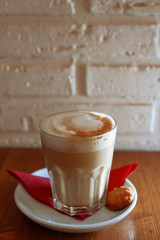 Glass Of Coffee On The Wooden Table