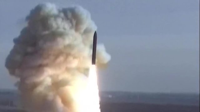 Missile launches from a base in an open field 2