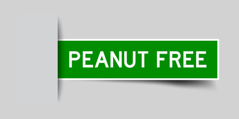 Square seal green color sticker in word peanut free insert on gray background