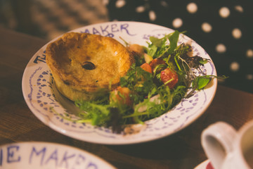 dinner plate with pot pie and salad