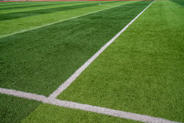 Obraz premium beautiful pattern of fresh green grass for football sport, football field, soccer field, team sport texture