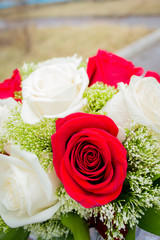 Wedding bouquet with red and white roses.