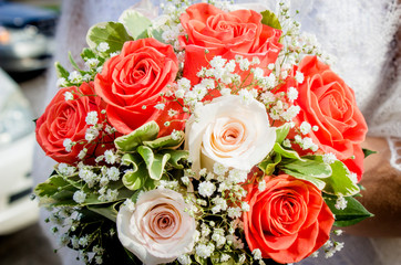 Wedding bouquet with red and white roses.