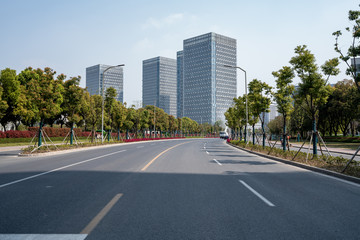 Fototapeta na wymiar Empty urban road and buildings