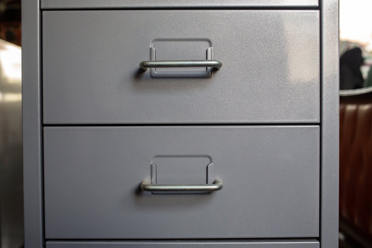 Filing cabinet with closed drawer, Grey silver metal colour, Administration and storage concept, closeup & Macro shot