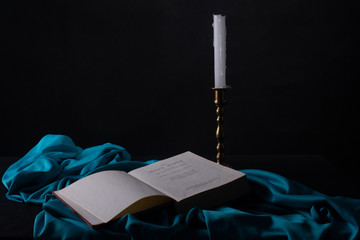 bible and candlestick
