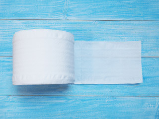 white Tissue paper on wooden blue background.